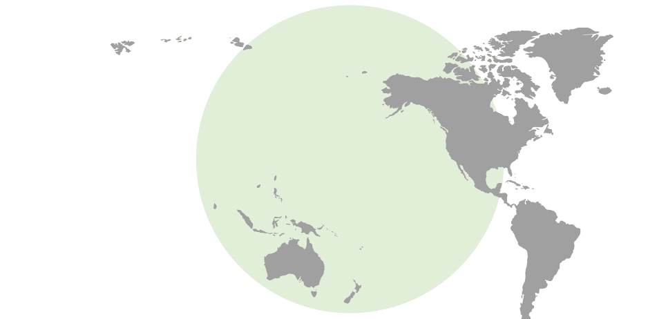 World map highlighting oceania and the western coast of the americas within a green circle.